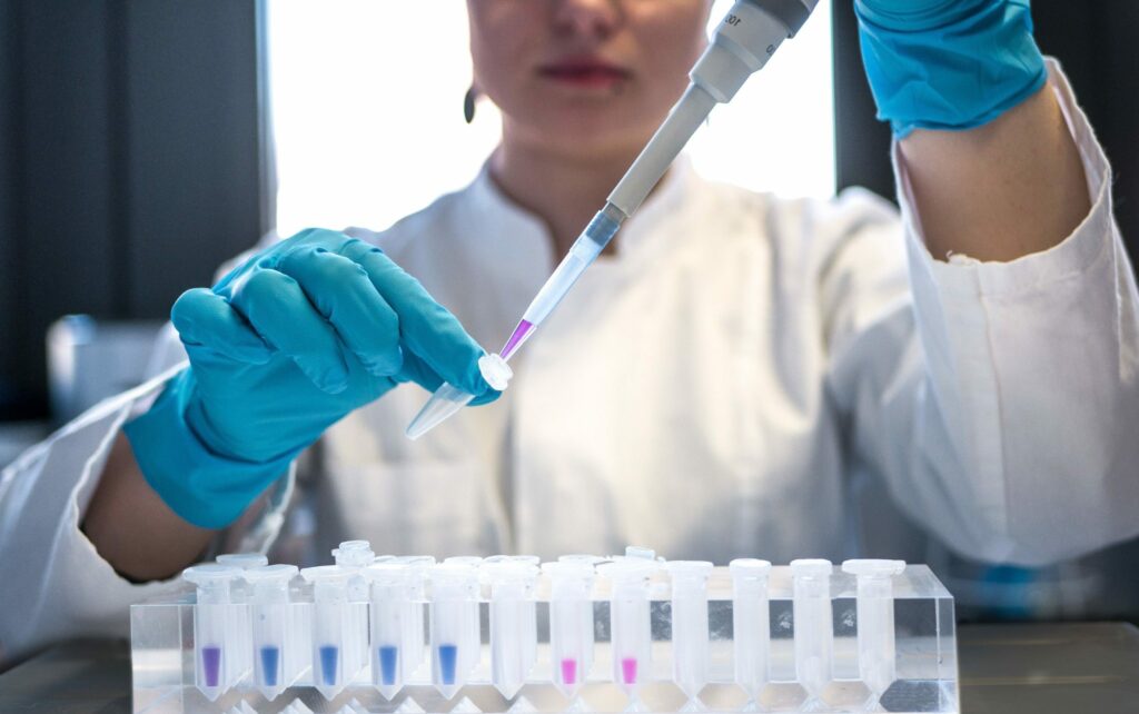 Woman researcher using a pipette