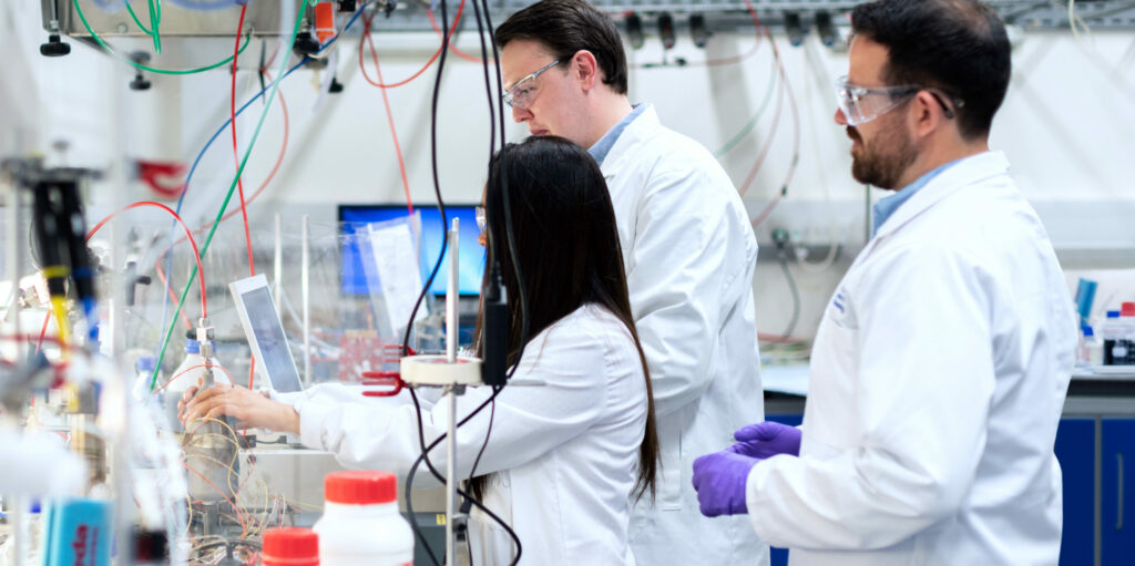 Research team collaborating in a lab