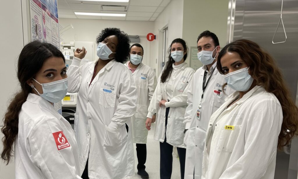 Team with Dr. Alain Moreau in a lab