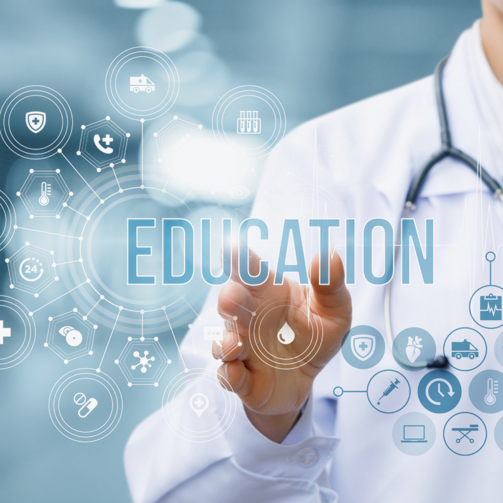 La main d'un médecin tend la main vers le mot éducation