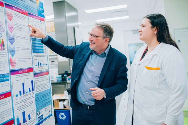 Evguenia Nepotchatykh and Alain Moreau looking at board