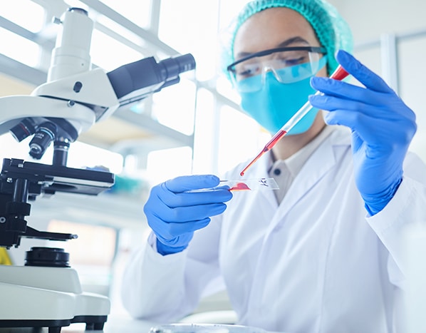 Woman researcher doing a blood test