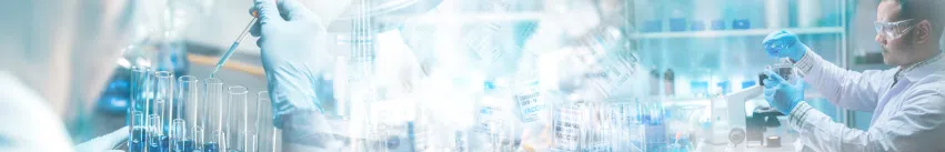 This image depicts a laboratory environment where scientists are actively engaged in research. The scene includes individuals wearing lab coats, gloves, and safety goggles, working with test tubes and pipettes.